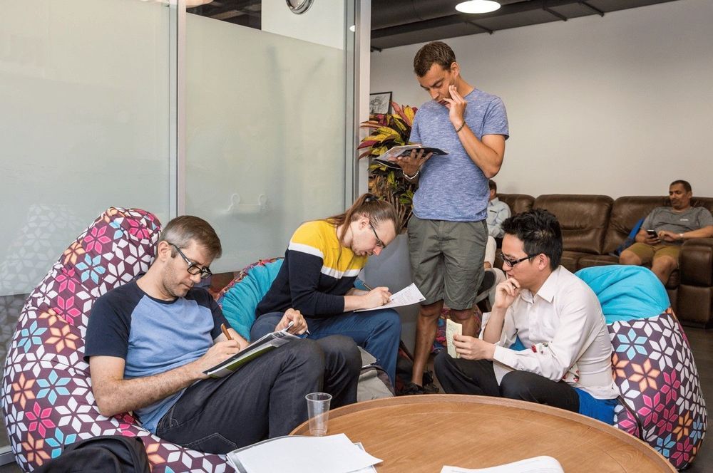 Students working in the lounge area of the school